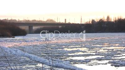 Ice drift in a river at sunset 17