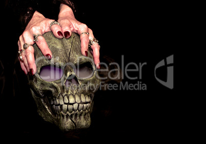 Hands and skull