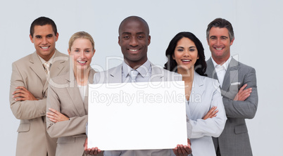 Afro-American businessman holding a white card with his team