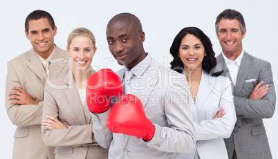 Afro-American businessman with boxing gloves leading his team