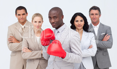 Afro-American businessman boxing and  leading his team