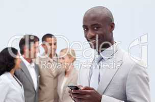 Smiling Afro-American businessman sending a message