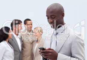Attractive Afro-American businessman writing a message