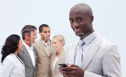 Afro-American businessman sending a text