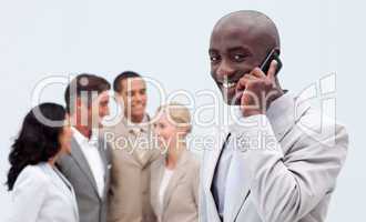 Afro-American businessman on phone at workplace