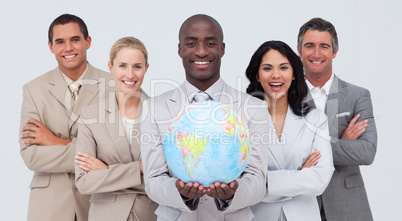 Afro-American businessman holding a terrestrial globe with his t