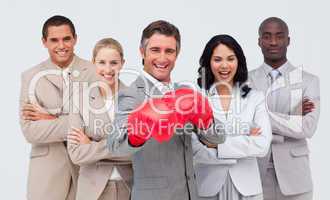 Smiling businessman with boxing gloves leading his team