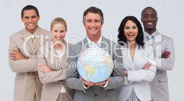 Business team holding a terrestrial globe