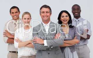 Smiling business team standing against white background