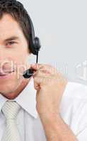 Close-up of an attractive businessman working in a call center