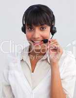 Smiling ethnic businesswoman working in a call center