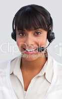 Beautiful ethnic businesswoman working in a call center