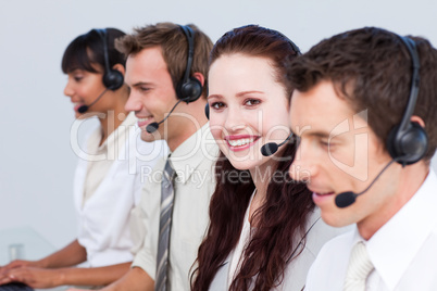 Woman working with more people in a call center