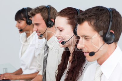 Manager working with his team in a call center