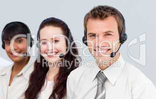 Young team with a headset on working in a call center