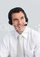 Smiling mature man working in a call center