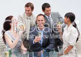 Business team toasting with champagne in the office