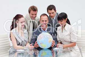 Business team holding the world. Global expansion