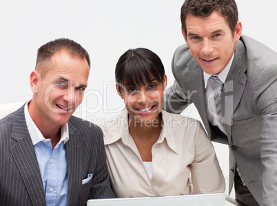 Business team working together with a computer