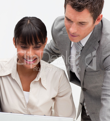 Businesswoman and businessman working together in an office