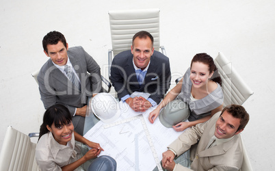 High angle of architects working with plans