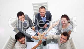 High angle of business team drinking champagne in the office