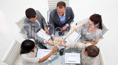 Business people toasting with champagne in the office