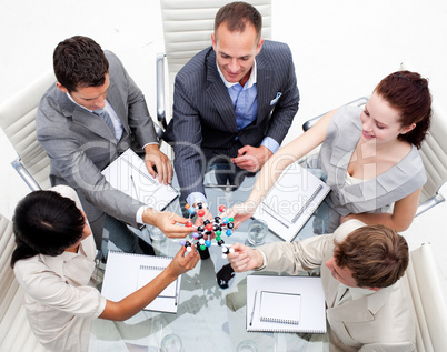 Business team examining molecules in the office