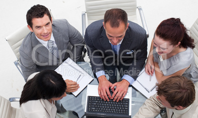 High angle of businessman working with his team