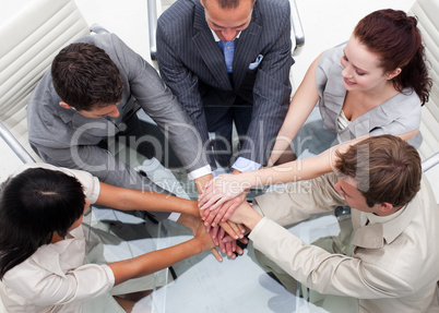 Close-up of business team with hands together. Teamwork