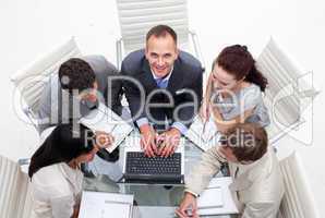 High angle of business manager working with his team