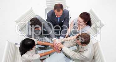 High angle of business people with hands together