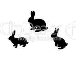 Schwarze Silhouette von drei Hasen auf weißem Hintergrund