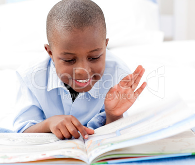 Small boy reading a book