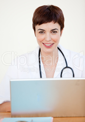 Doctor sitting at desk in Hospital