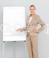 Businesswoman Standing  pointing at a whiteboard