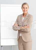 Business woman standing at a presentation board