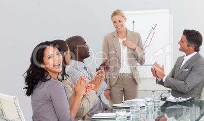 Businesswoman standing smilling after a presentation