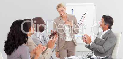 Businesswoman standing smilling after a presentation