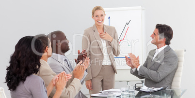 Businesswoman standing smilling after a presentation