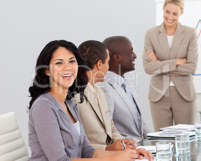 Businesswoman in a meeting smiling