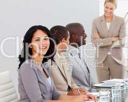 Businesswoman in a meeting smiling