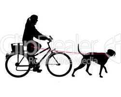 Radfahrerin mit Hund an der Leine