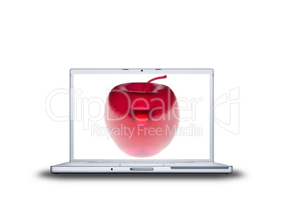 3D red glass apple on laptop