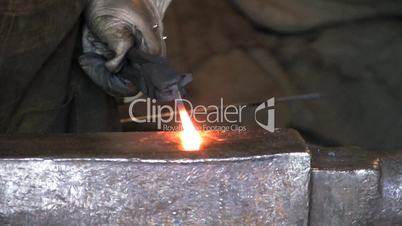 Blacksmith Flattening Metal