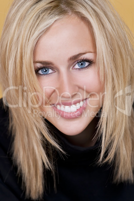 Beautiful Happy Young Blond Woman With Perfect Teeth and Smile