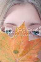 The girl with maple autumn sheet