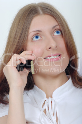 The smiling girl with a mobile phone