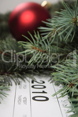 Calendar for 2010 covered with fur-tree branches