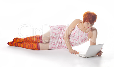 Red Girl in stripe socks  with laptop on white background